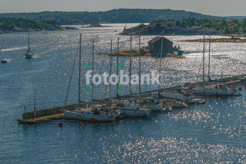 A small island in the sea where ships are waiting to be deaprted