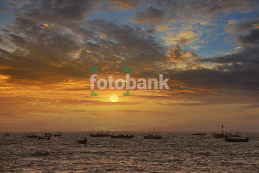 Sunset in the sea where Clouds and Boats Beautiful Landscape