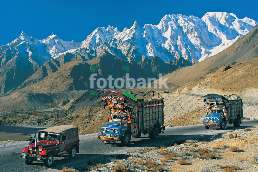 Pakistani Trucks Travelling on the Dangerous Raods of Mountains Covered with Snow