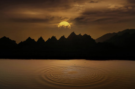 A Beautiful Sunset in the Mountains infront of the lake