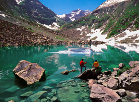 A Crystal Clear Lake and the Mountains Covered in Snow