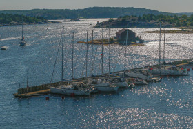 A small island in the sea where ships are waiting to be deaprted