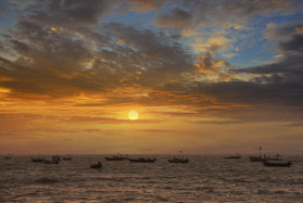 Sunset in the sea where Clouds and Boats Beautiful Landscape